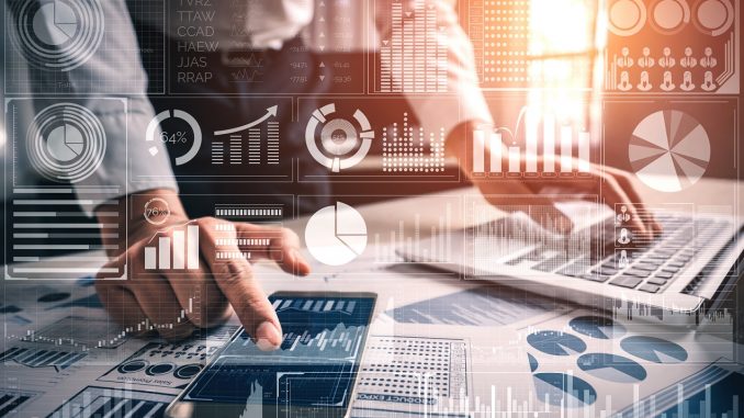 Big Data Technology for Business Finance Analytic Concept. Modern graphic interface shows massive information of business sale report, profit chart and stock market trends analysis on screen monitor.
